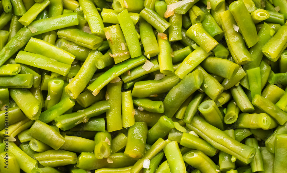 Green beans fried with onions close up texture. High quality photo Green beans fried with onions close up texture. High quality photo