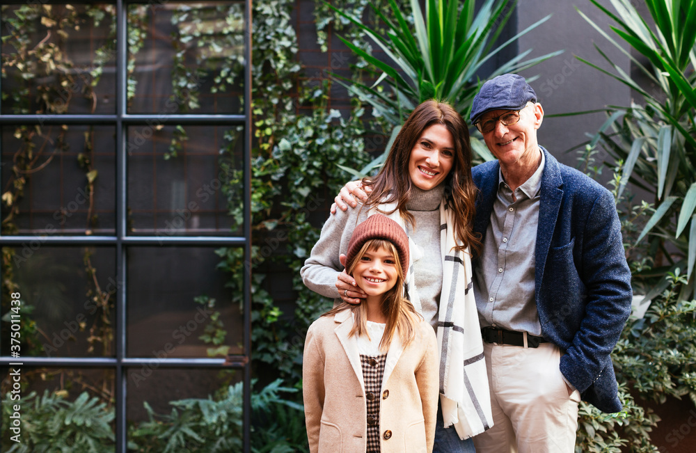 Happy multi generational family in suburban yard Happy multi generational family in suburban yard
