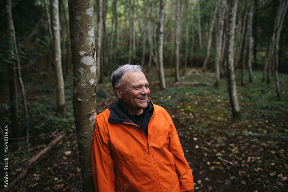 A peacefule, retired age man spending solitude in the forest. A peacefule, retired age man spending solitude in the forest.