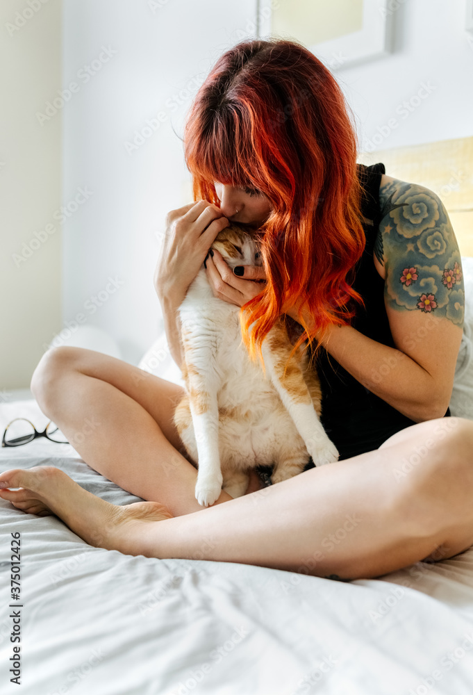 Young modern woman and her cat Young modern woman and her cat