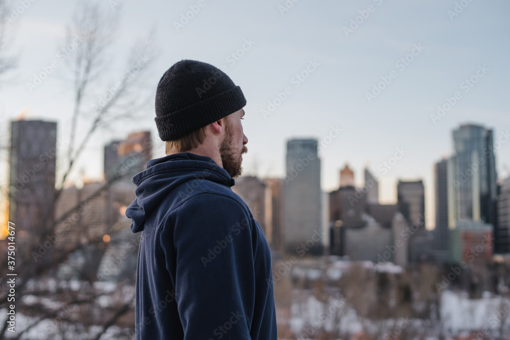 Active young bearded man training outside in winter. Active young bearded man training outside in winter.