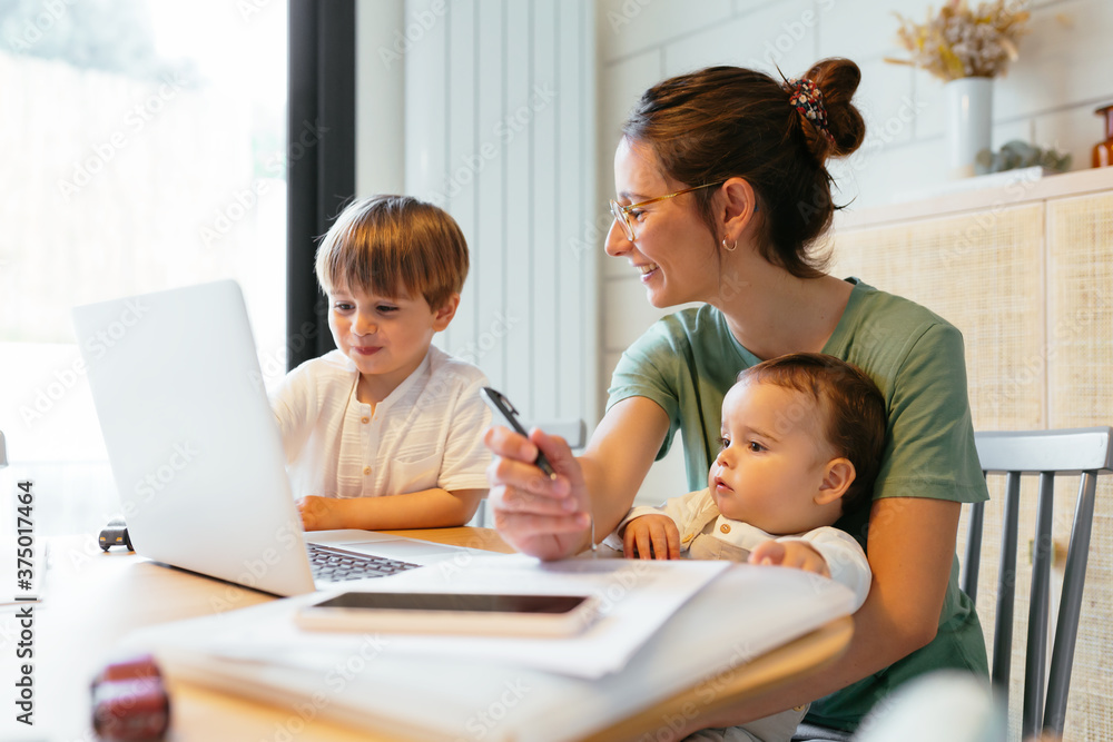 Happy family using the laptop at home Happy family using the laptop at home