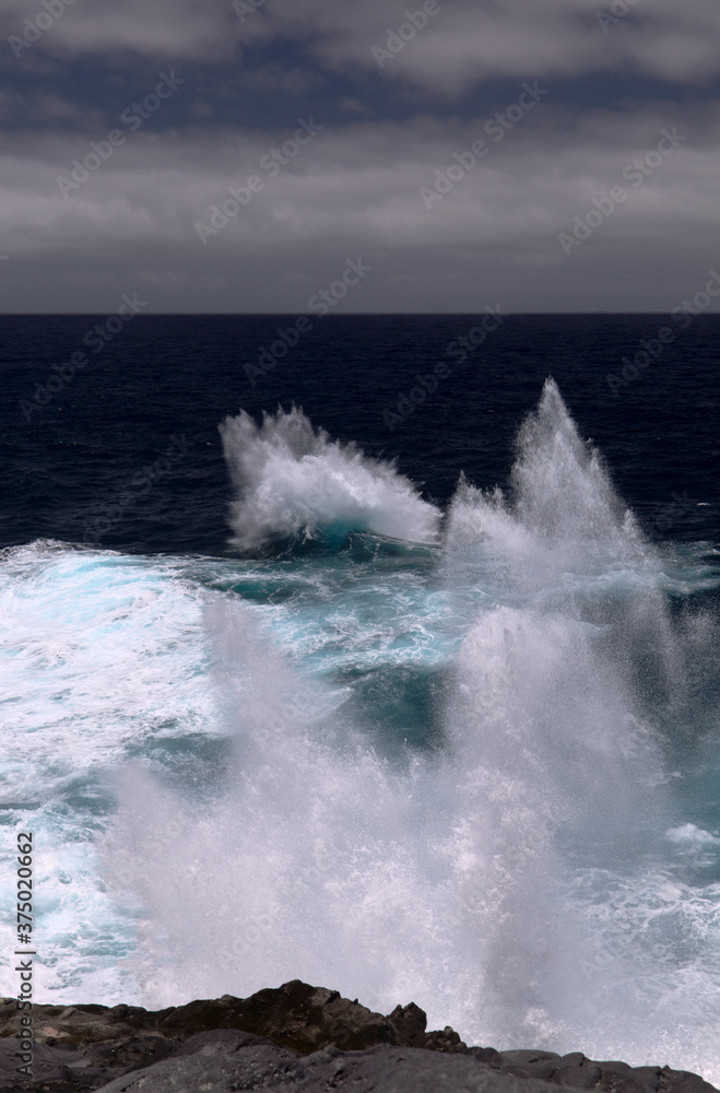 Fototapeta premium North coast of Gran Canaria, Canary Islands, Banaderos area, strangely shaped wave, resembling underwater explosion, formed by a clash of incoming and reflected waves