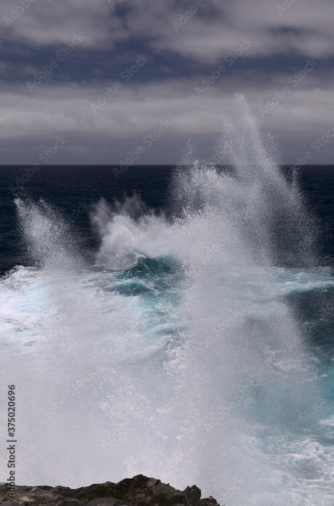 North coast of Gran Canaria, Canary Islands, Banaderos area, strangely shaped wave, resembling underwater explosion,
formed by a clash of incoming and reflected waves North coast of Gran Canaria, Canary Islands, Banaderos area, strangely shaped wave, resembling underwater explosion,
formed by a clash of incoming and reflected waves