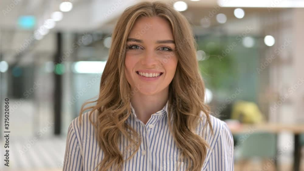 Portrait of Smiling Businesswoman Looking at Camera Portrait of Smiling Businesswoman Looking at Camera