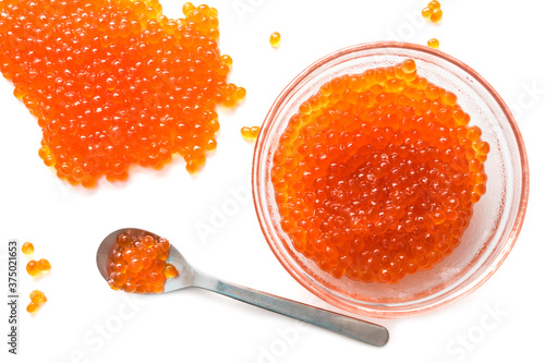 Red caviar in glassware with spoon isolate on white background

