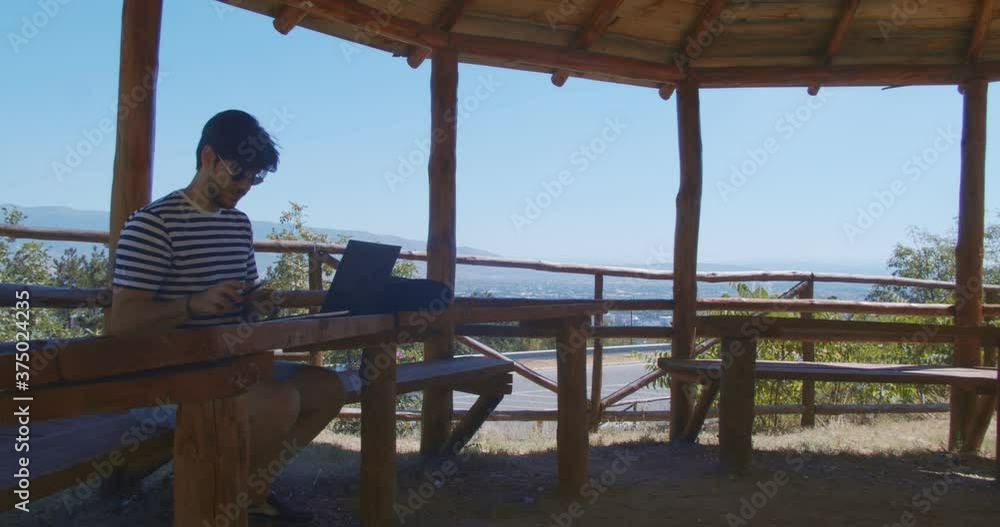 Freelancer working remotely from the forest Freelancer working remotely from the forest