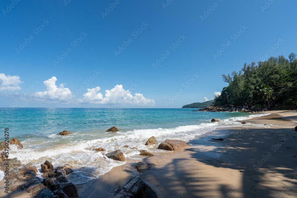 Summer  beach Ocean view with blue sky , white sand  and wave .background