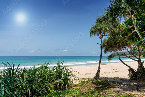 Summer beach Ocean view with blue sky , white sand and wave .background