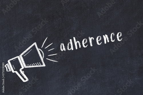 Chalk loudspeaker and inscription adherence on black chalkboard