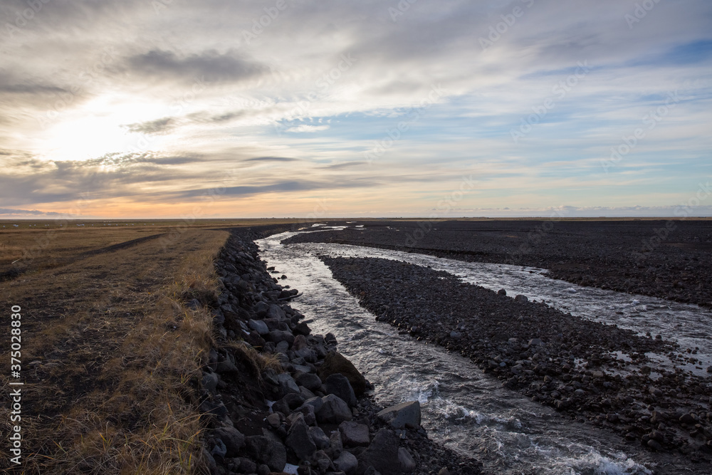 river flows in volcanic landscape river flows in volcanic landscape