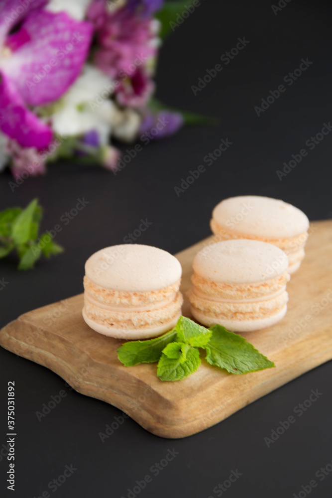Macarons and mint for dessert - healthy organic summer dessert. Creative atmospheric decoration. Macarons and mint for dessert - healthy organic summer dessert. Creative atmospheric decoration.