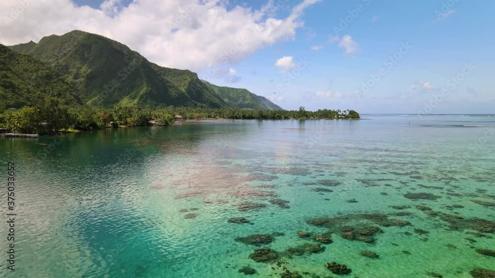 Ocean lagoon, beautiful coastal landscape of Tahiti. Drone aerial shot. Tropical paradise, island travel. Teahupoo, French Polynesia 4k. Ocean lagoon, beautiful coastal landscape of Tahiti. Drone aerial shot. Tropical paradise, island travel. Teahupoo, French Polynesia 4k.