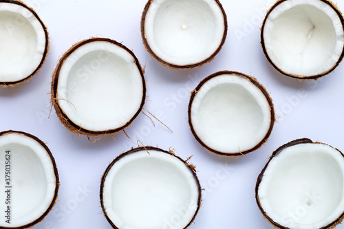 Half coconuts on white background.