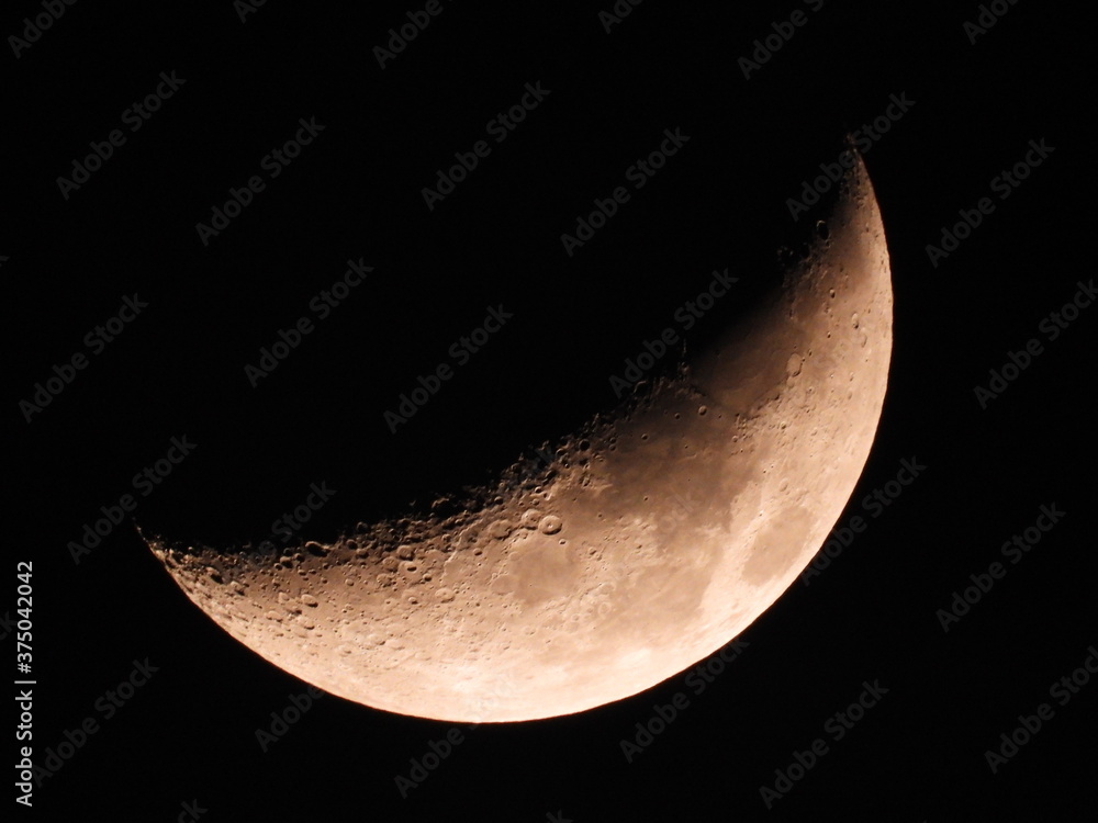 Moon background / The Moon as it appears early in its first quarter or late in its last quarter, when only a small arc-shaped section of the visible portion is illuminated by the Sun.
Moon background / The Moon as it appears early in its first quarter or late in its last quarter, when only a small arc-shaped section of the visible portion is illuminated by the Sun.