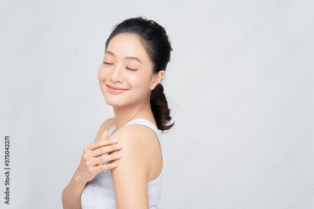 Beautiful female asian face with natural perfect skin in studio portrait Beautiful female asian face with natural perfect skin in studio portrait