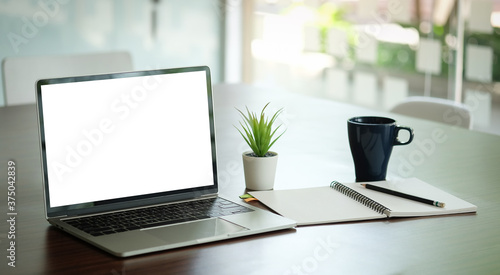 Wallpaper Mural Workspace desk and laptop. copy space and blank screen. Business image, Blank screen laptop and supplies. Torontodigital.ca