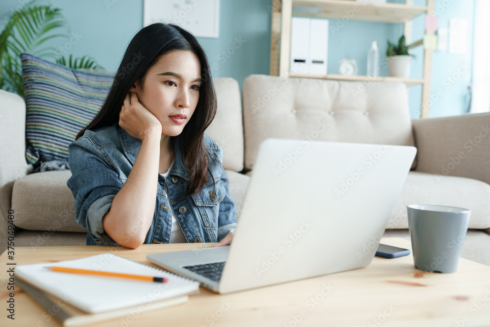 working from home. beautiful Asian young woman using computer laptop working from home. beautiful Asian young woman using computer laptop