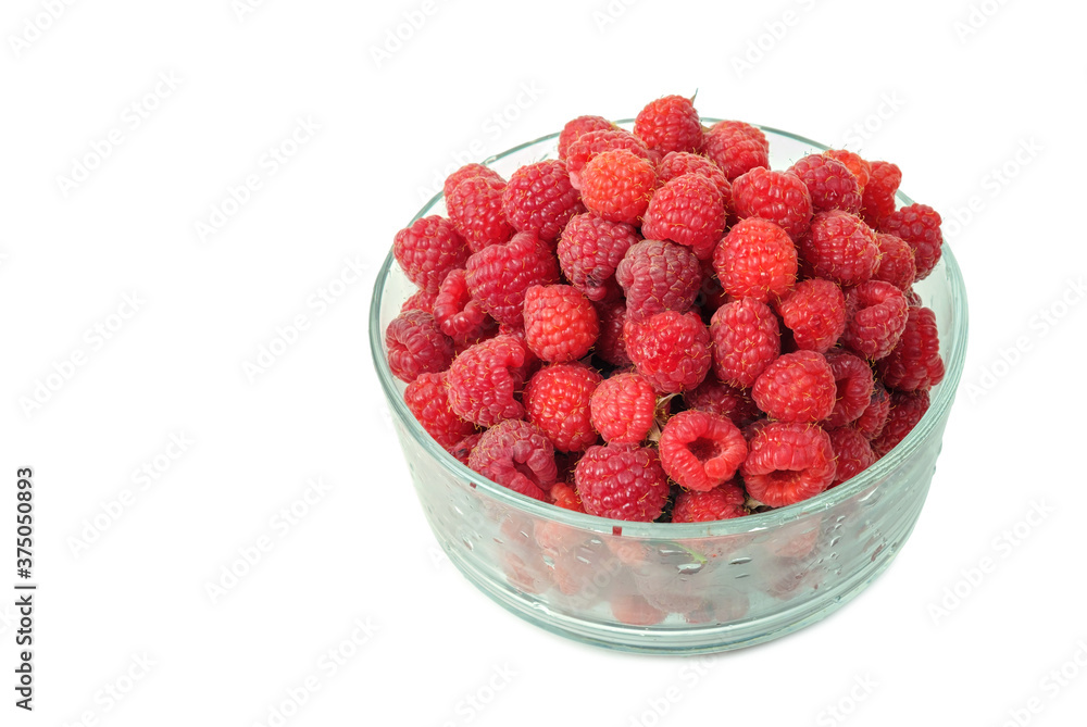 Fresh raspberries in a glass bowl on a white background Fresh raspberries in a glass bowl on a white background