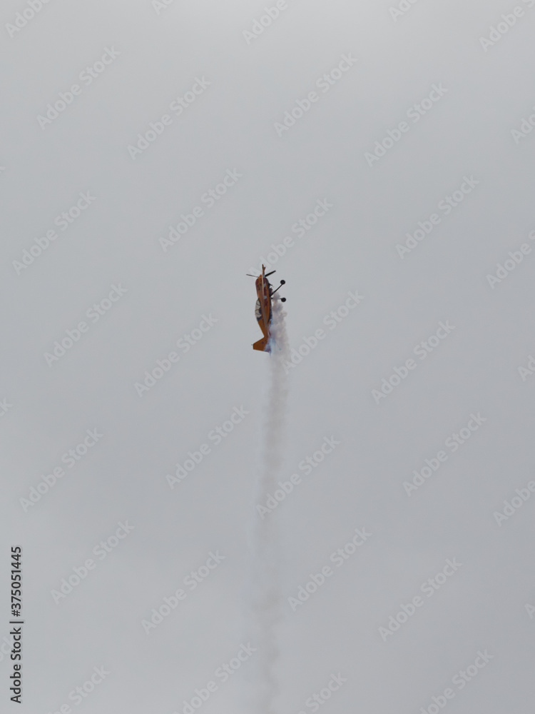 Fototapeta premium Pilot performances of Yak piston aircraft at the air show