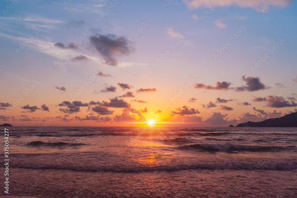 Tropical nature sea or beach in summer time with sunrise or sunset with light flare.