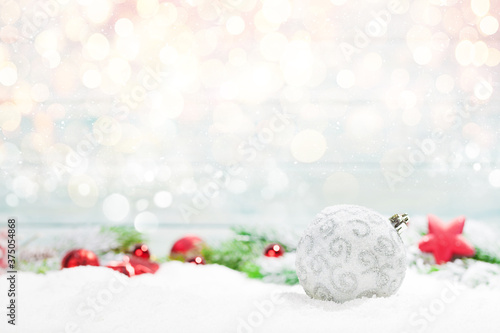Christmas greeting card with decor in snow