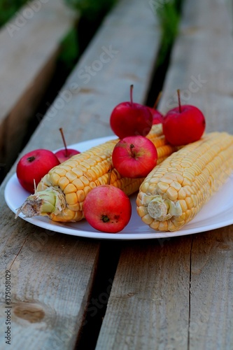 Wallpaper Mural 
Two ears of corn and apples on a plate Torontodigital.ca