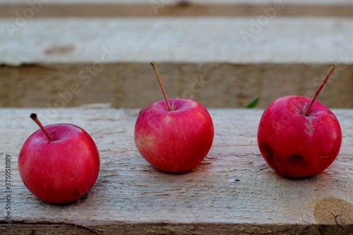 Wallpaper Mural red apples on wooden table Torontodigital.ca