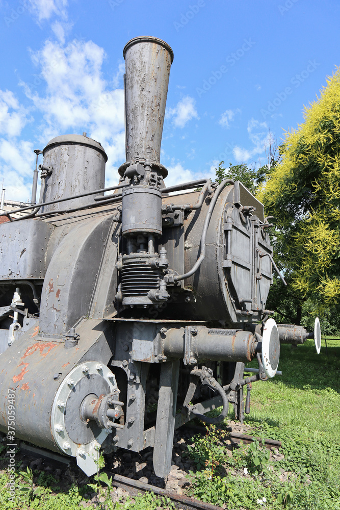 Old locomotive next to the railway station
