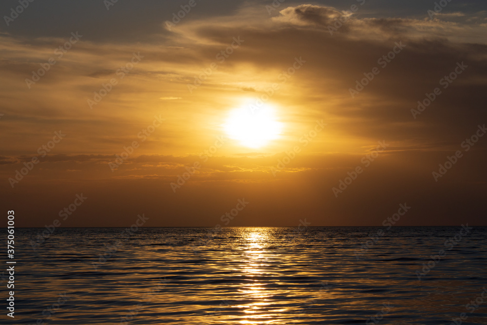 incredibly beautiful golden sunset over the sea for background and screensaver