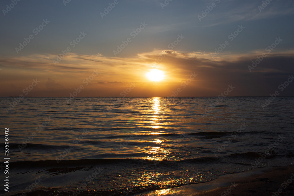 beautiful golden sunset over the sea for background and splash