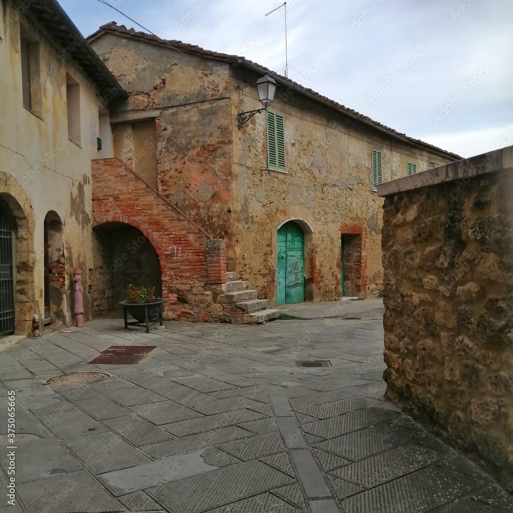 street in the asciano old town, italy
