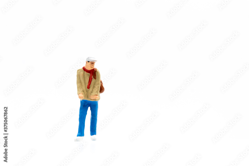 Miniature people standing on white background and copy space for your text Miniature people standing on white background and copy space for your text