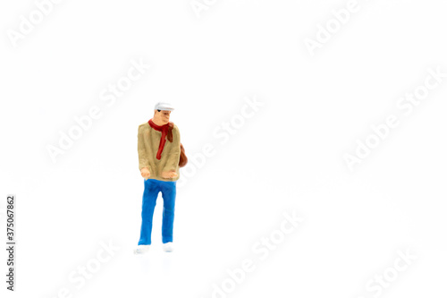 Miniature people standing on white background and copy space for your text 