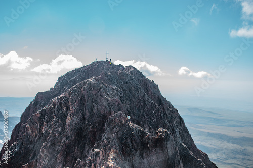 man on the top of the mountain