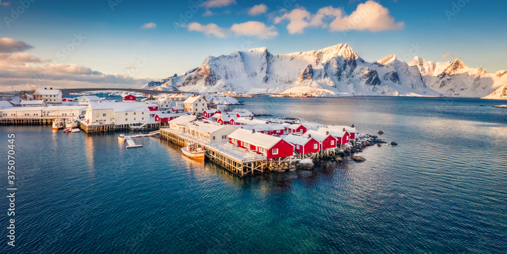 View from flying drone of small fishing town - Hamnoy, Norway, Europe. Panoramic morning seascape of Norwegian sea. Fantastic winter scene of Lofoten Island. Life over polar circle.