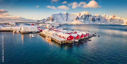 View from flying drone of small fishing town - Hamnoy, Norway, Europe. Panoramic morning seascape of Norwegian sea. Fantastic winter scene of Lofoten Island. Life over polar circle. © Andrew Mayovskyy