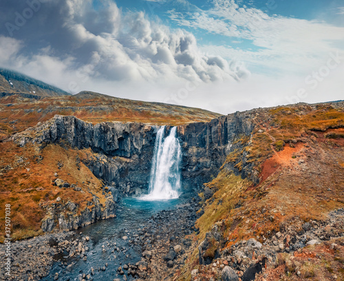 View from flying drone of Gufufoss  Gufu Waterfall . Colorful autumn scene of typical volcanic landscape of Iceland  Europe. Beauty of nature concept background.