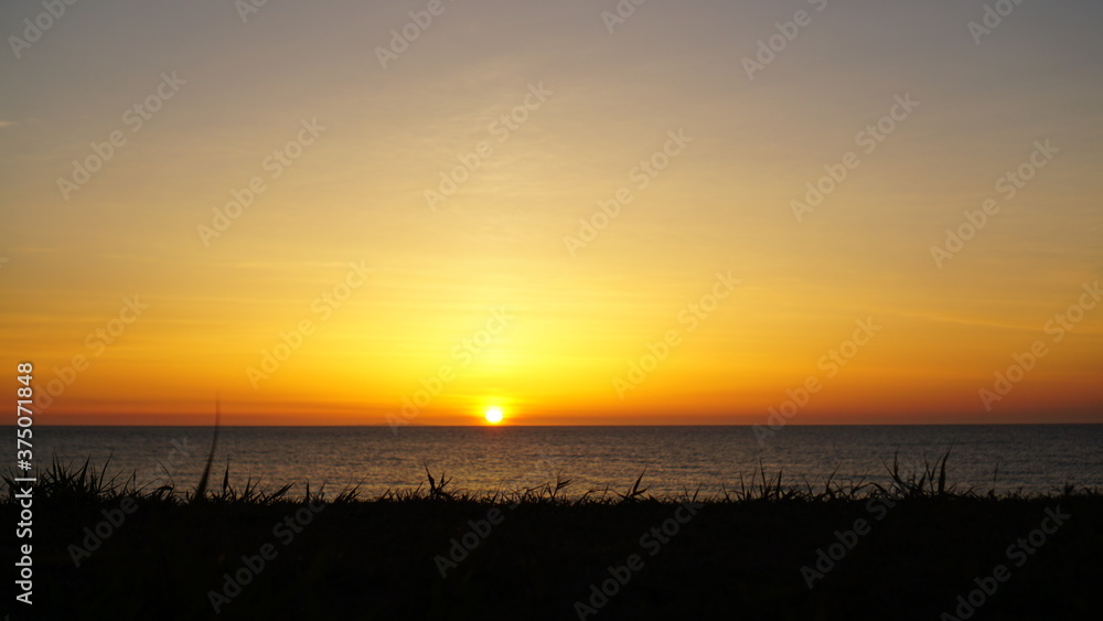 Orange sunset colored the sea landscape