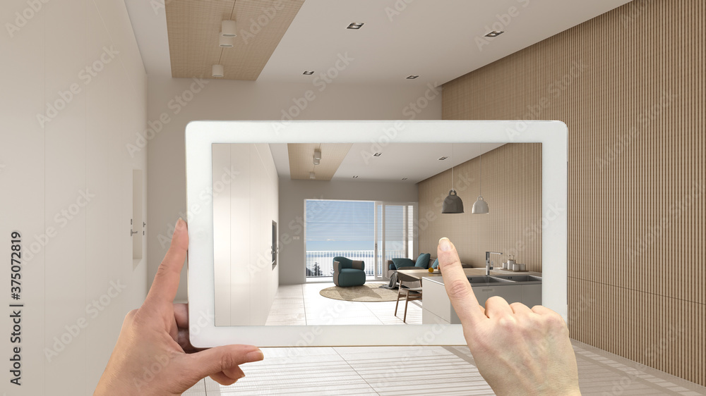 Augmented reality concept. Hand holding tablet with AR application used to simulate furniture and design products in empty interior with marble floor, modern living and dining room Augmented reality concept. Hand holding tablet with AR application used to simulate furniture and design products in empty interior with marble floor, modern living and dining room