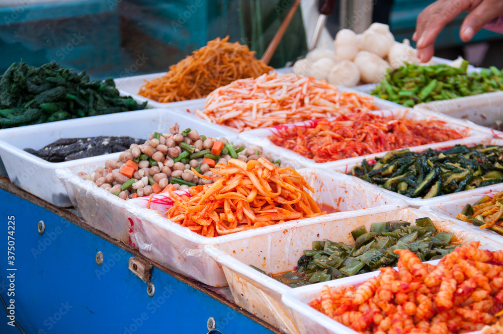 Sale of Chinese salads in the Chinese market, street food