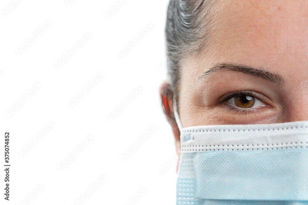 Half face close-up woman wearing disposable mask with copyspace Half face close-up woman wearing disposable mask with copyspace