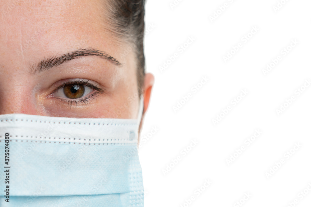 Close-up female face wearing medical or surgical mask copyspace Close-up female face wearing medical or surgical mask copyspace