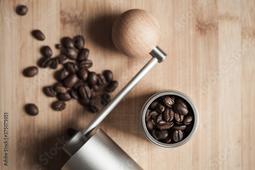 Manual coffee grinder and roasted coffee beans