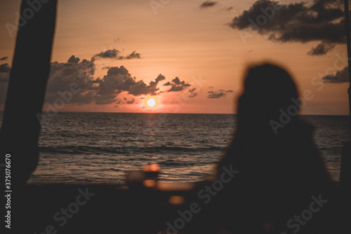 silhouette of a couple at sunset © Thanarat