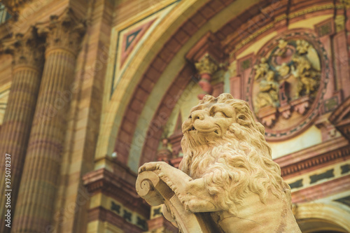 Detail of the cathedral with a lion figure in Malaga in Spain