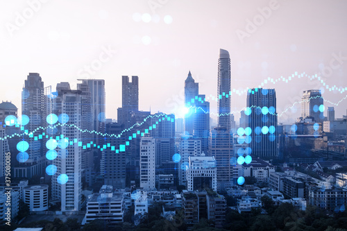 Glowing FOREX graph hologram  aerial panoramic cityscape of Bangkok at sunset. Stock and bond trading in Asia. The concept of fund management. Double exposure.