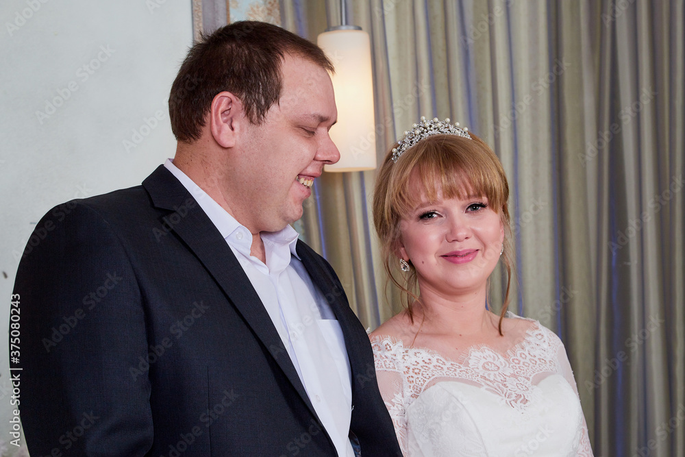 Bride and big fat groom in a nice room Bride and big fat groom in a nice room