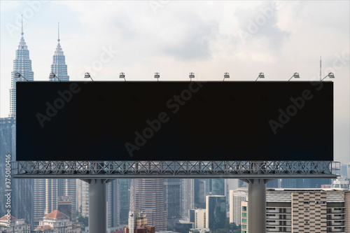Photography Blank black road billboard with Kuala Lumpur cityscape background at day time