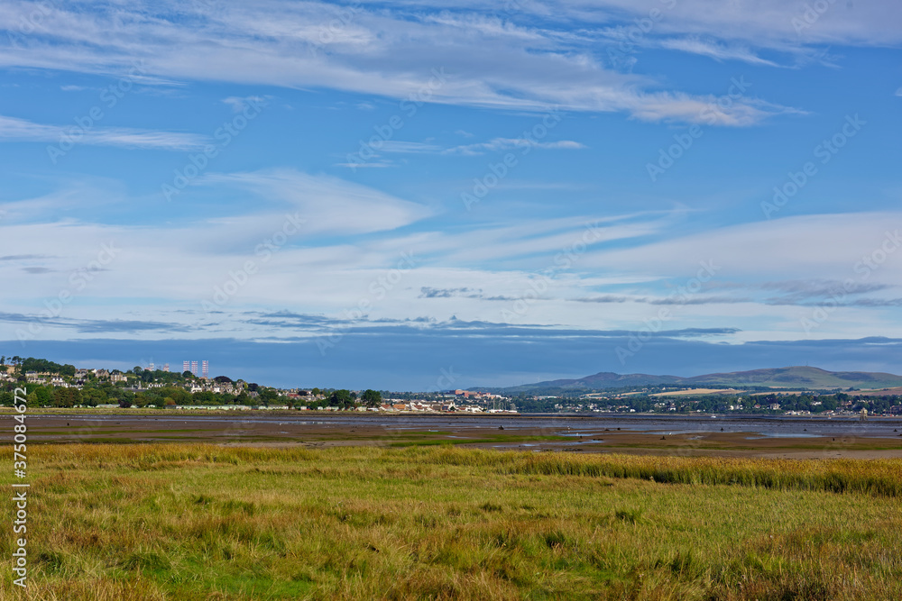 Looking back over the beginning of Tay Heath towards the small town of Tayport and Brought Ferry across the Tay Estuary at Low Tide.